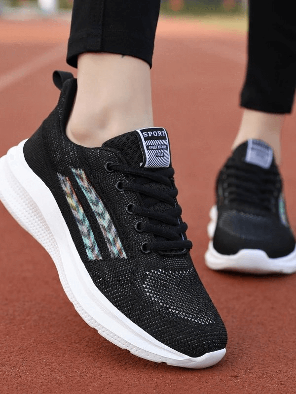 Black Sports Mesh Breathable Women's Shoes SF0212 on track, featuring EVA outsole, stretch fabric, and lace-up design for optimal comfort.